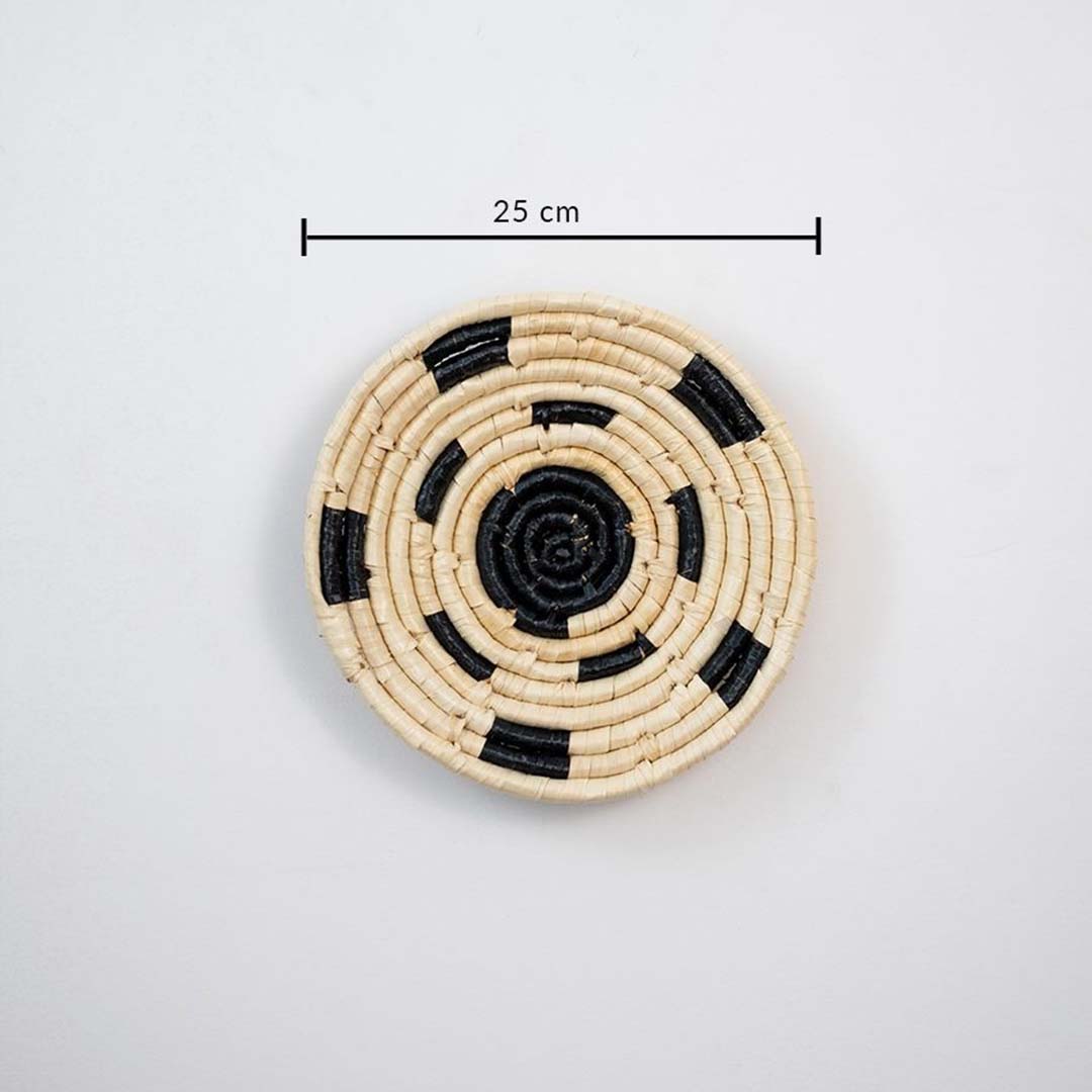 Small handcrafted round wall basket in natural and black tones showing 22 cm diameter suitable for compact wall decor use.