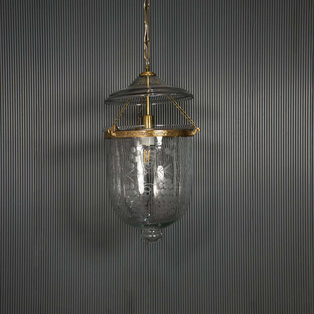Sleek antique style glass lantern turned off isolated on a pitch black background for a dramatic and high contrast presentation.