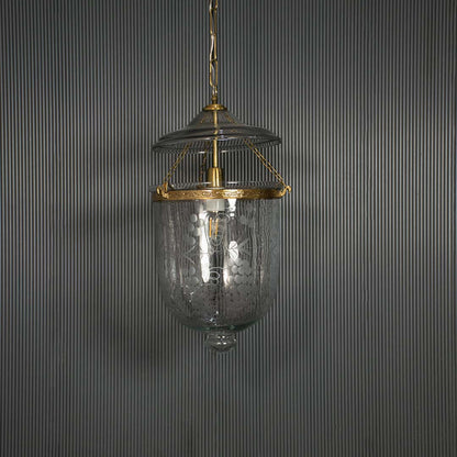 Sleek antique style glass lantern turned off isolated on a pitch black background for a dramatic and high contrast presentation.