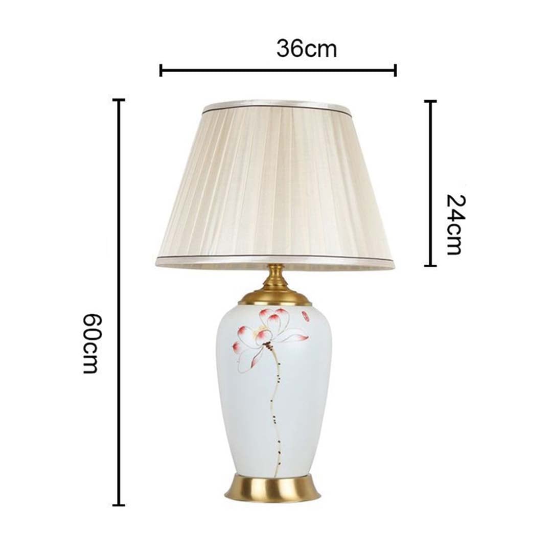 Elegant floral ceramic table lamp 60 cm tall and 36 cm wide featuring gold base and cream pleated shade ideal for refined room styling.