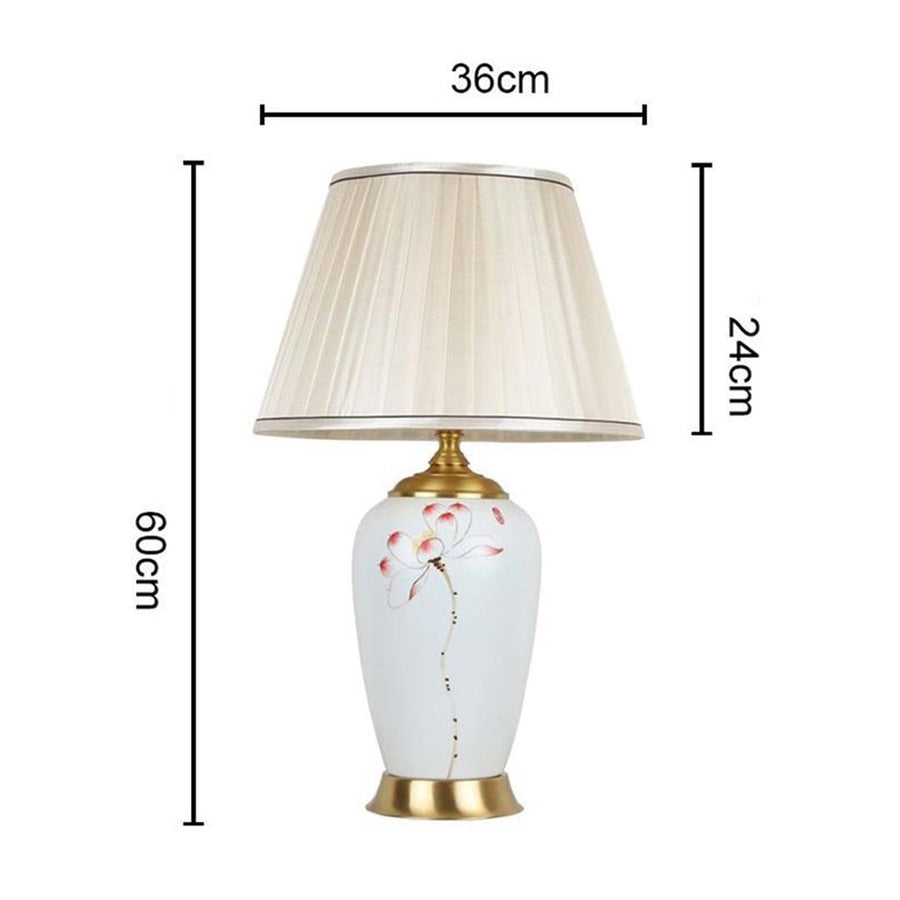 Elegant floral ceramic table lamp 60 cm tall and 36 cm wide featuring gold base and cream pleated shade ideal for refined room styling.