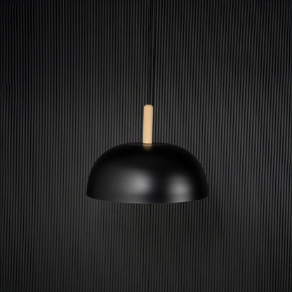 Black dome pendant ceiling light with wood top switched off on back background for modern dining room cafe and home ceiling lighting decor.