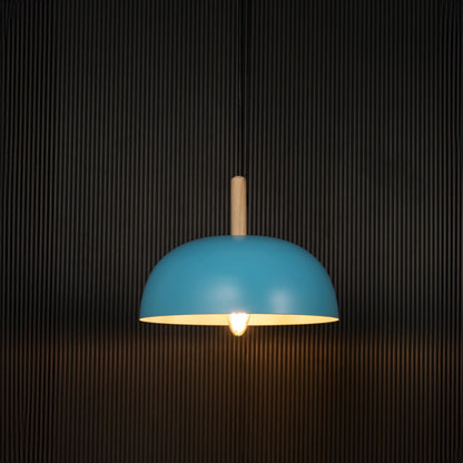 Blue pendant ceiling lamp on black background with dome shade and wooden top accent is a Nordic style hanging light.