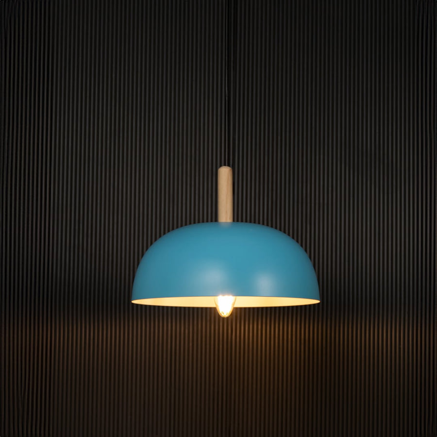 Blue pendant ceiling lamp on black background with dome shade and wooden top accent is a Nordic style hanging light.