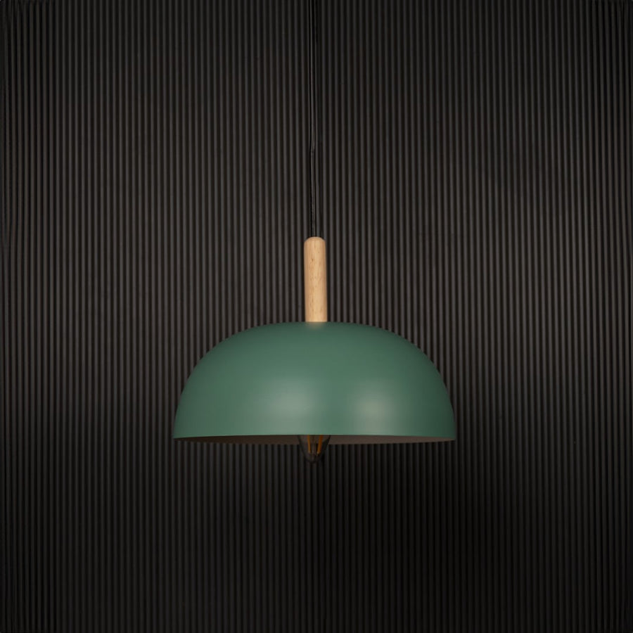 Green dome pendant ceiling light with wooden top switched off on back background for stylish dining room cafe and modern home ceiling lighting decor.