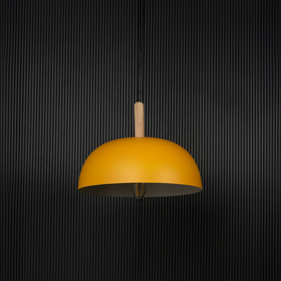 Yellow dome pendant light with wooden holder and bulb off on black background for a modern home lighting look.