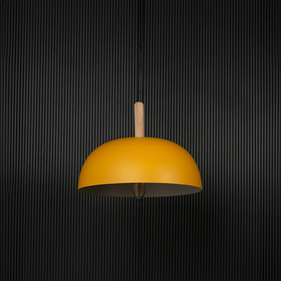 Yellow dome pendant light with wooden holder and bulb off on black background for a modern home lighting look.