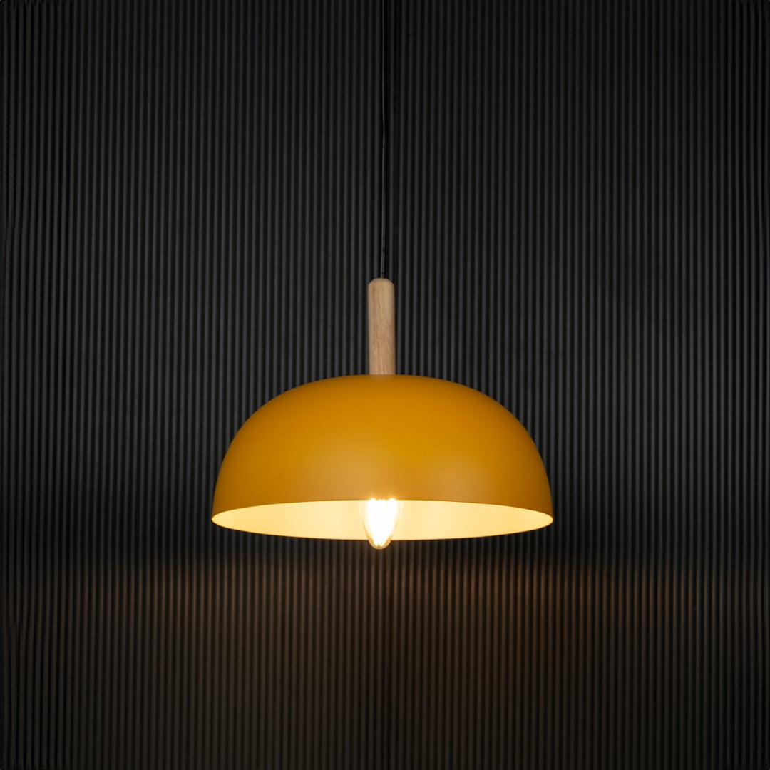 Yellow dome pendant light with wooden top displayed on black background is contemporary ceiling lighting for stylish home decor.
