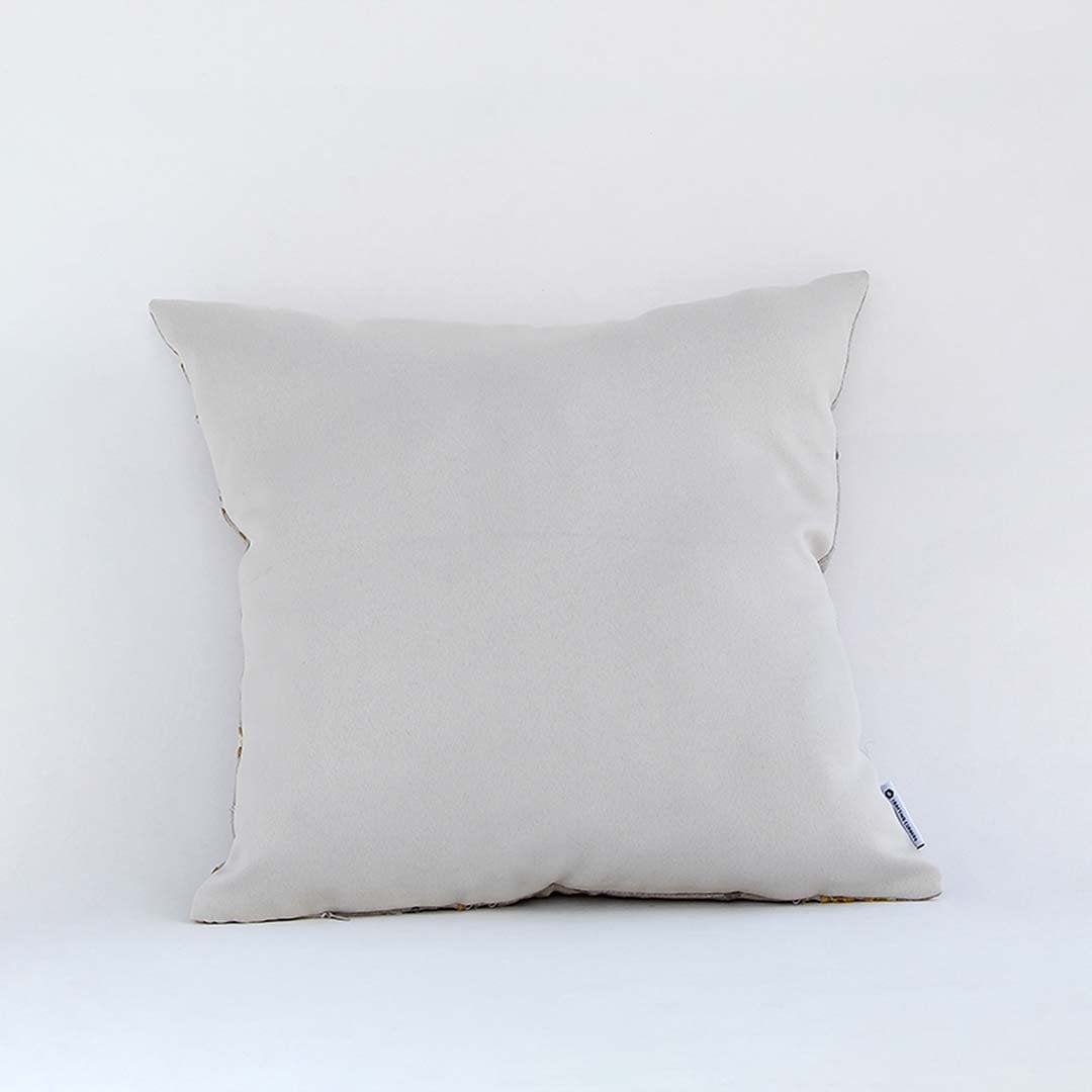 Back view of cotton cushion featuring plain white showing plush texture and fine stitching ideal for sofa and bed decor.
