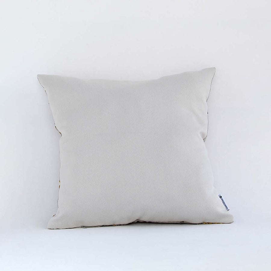 Back view of cotton cushion featuring plain white showing plush texture and fine stitching ideal for sofa and bed decor.