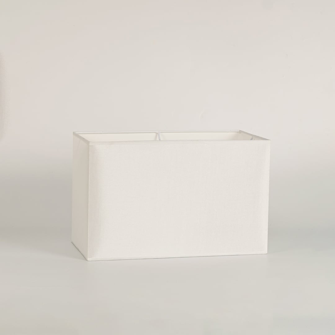 White rectangular lamp shade on plain background shown in close up view for modern minimal lighting décor.
