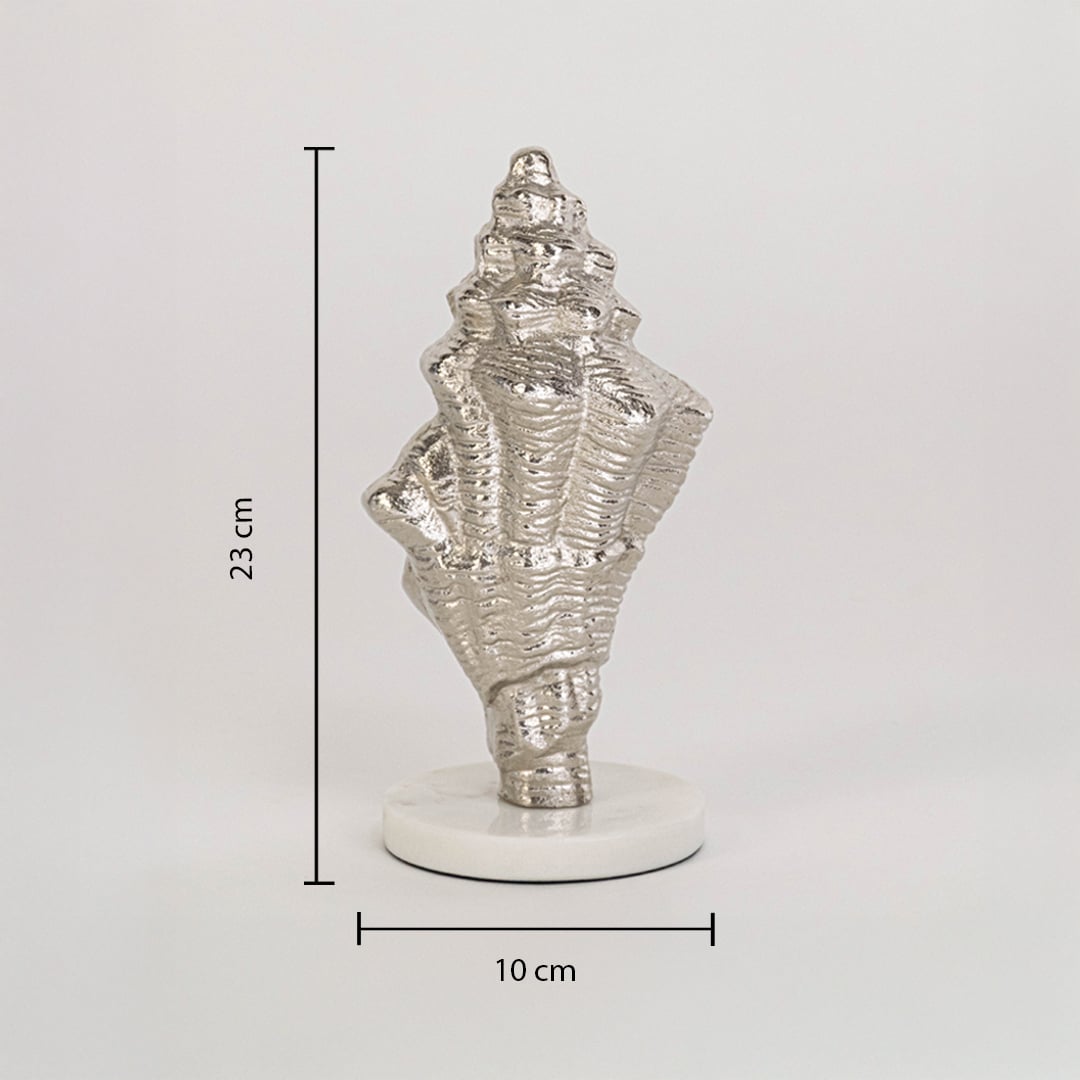 Decorative silver conch shell on white base measuring 23 cm high and 10 cm wide shown on clean white background