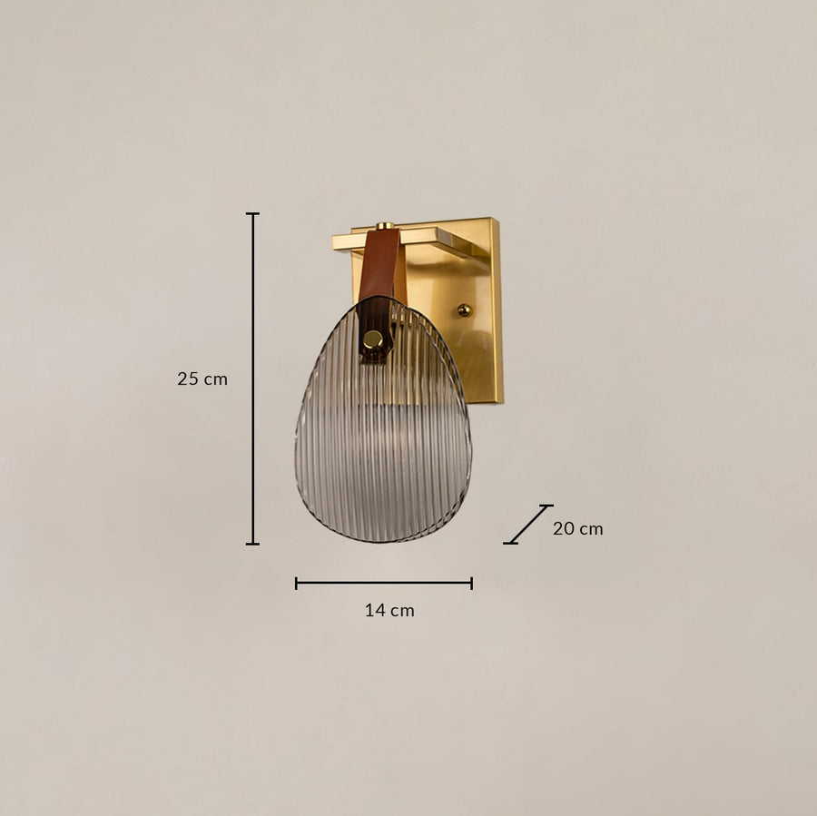 Gold wall light with ribbed glass shade measuring 14 cm width 25 cm height and 20 cm depth for accurate placement.
