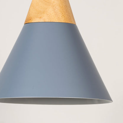 Closeup of blue pendant light with conical metal shade and wooden top showing elegant modern home lighting design.