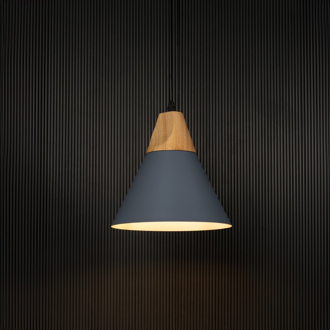 Blue pendant light with wooden top and conical shade displayed on black background for modern rustic home lighting.