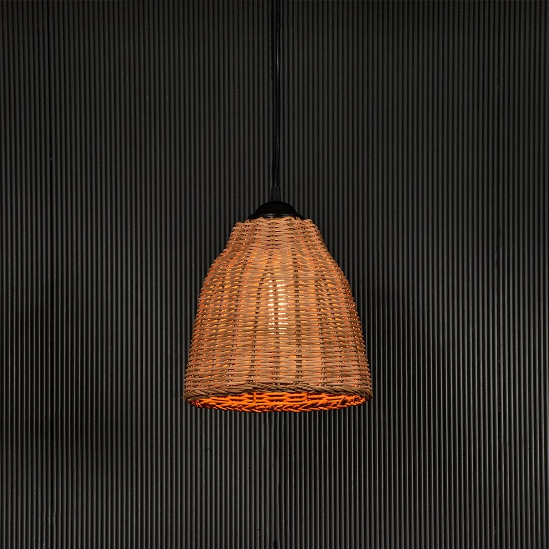Woven rattan pendant light with handcrafted shade displayed on black background for rustic home lighting.