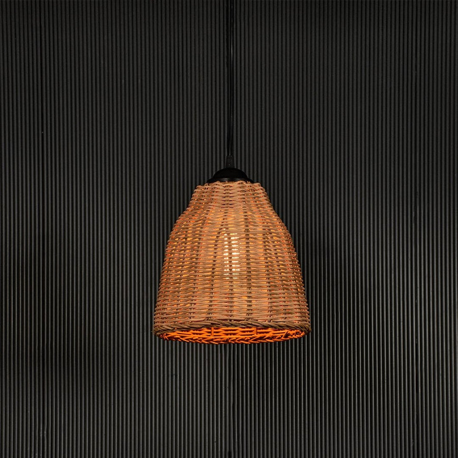 Woven rattan pendant light with handcrafted shade displayed on black background for rustic home lighting.