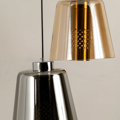 Closeup grouped shot of gold metallic pendant light showing detailed perforated centre and reflective finish for elegant modern decor.