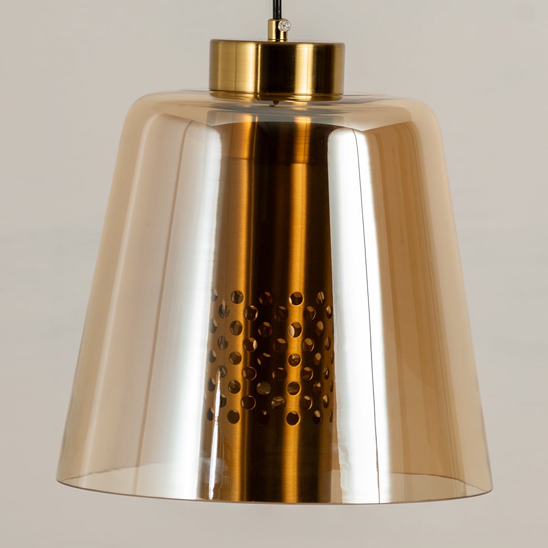 Closeup of gold metallic pendant light showing polished reflective surface and perforated detail ideal for stylish contemporary interiors.