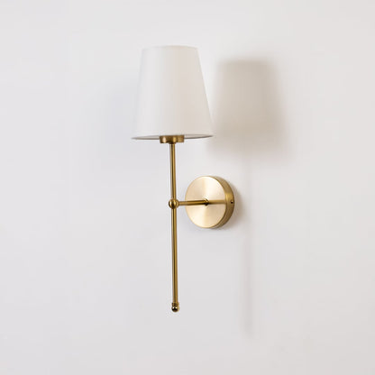 Gold wall light with a white shade displayed on a white background showing its elegant minimal shape.