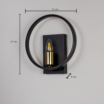 Black wall light with gold bulb holder and circular frame shown on white background measuring 27cm height and 25cm width.