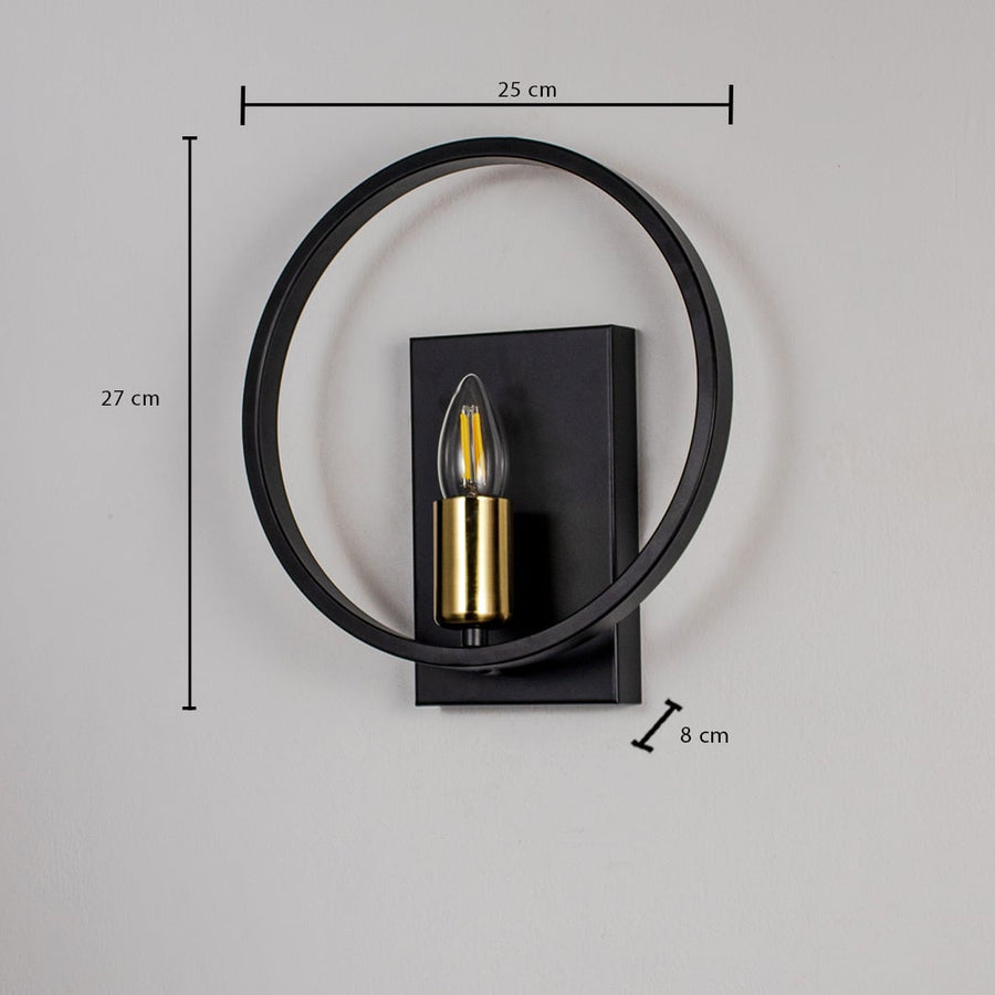 Black wall light with gold bulb holder and circular frame shown on white background measuring 27cm height and 25cm width.