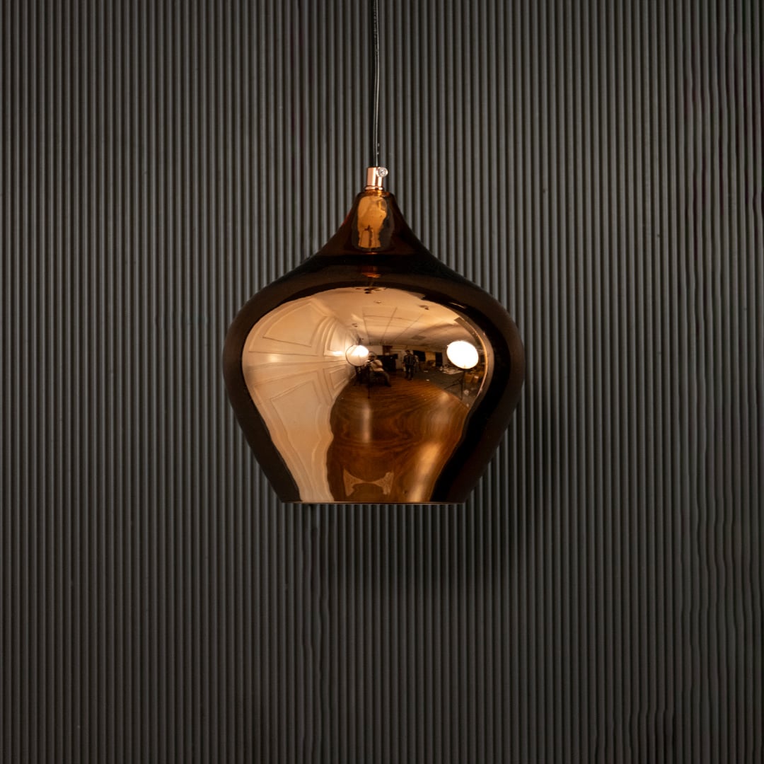 Gold reflective pendant light with lights off on black background highlighting its glossy metal finish and modern curved silhouette.