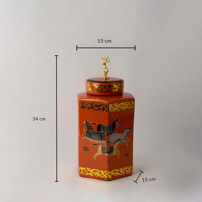 Orange ceramic jar with gold horse artwork and deer lid shown with 34 cm height and 15 cm width for size reference.