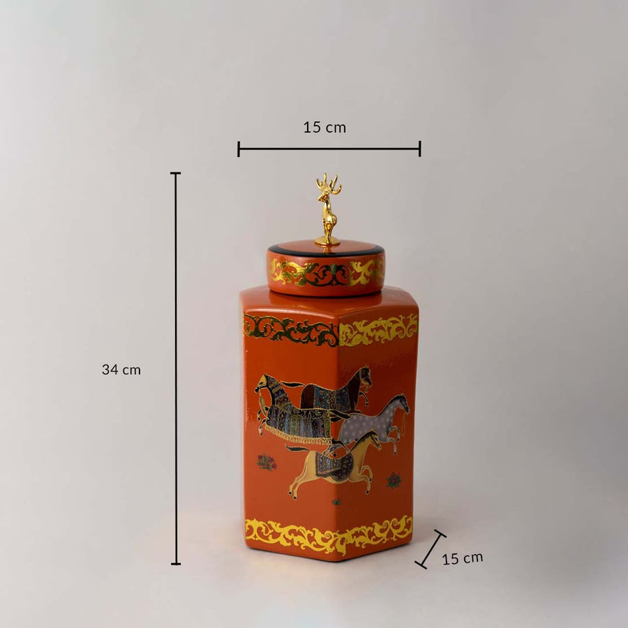 Orange ceramic jar with gold horse artwork and deer lid shown with 34 cm height and 15 cm width for size reference.