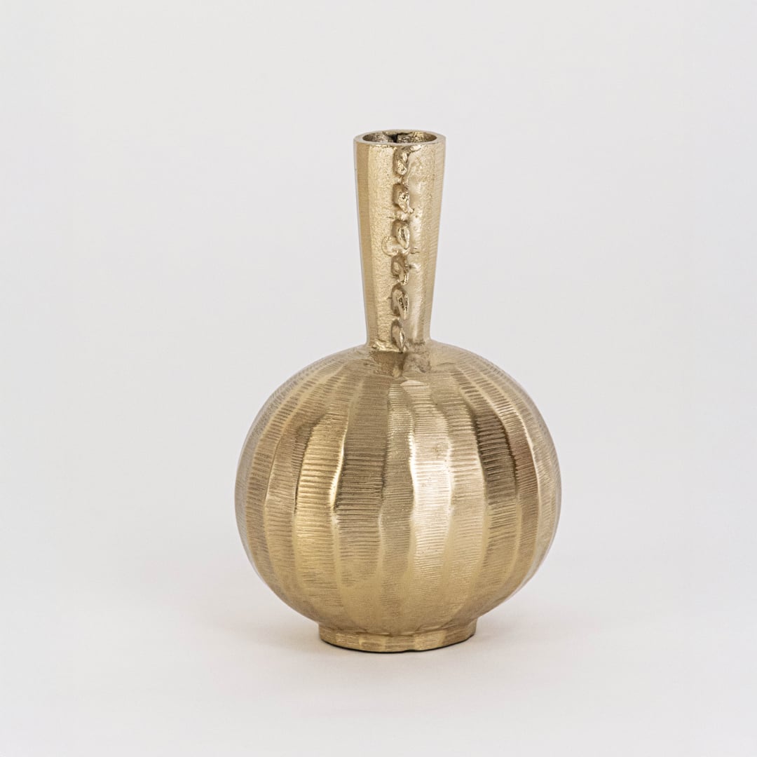 Golden designer vase placed on a clean white backdrop showing its handcrafted texture and unique top structure