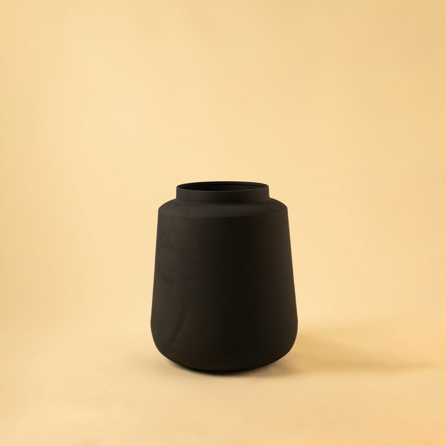 Black metal modern vase decor on clean white background ideal for shelves consoles and contemporary home styling.