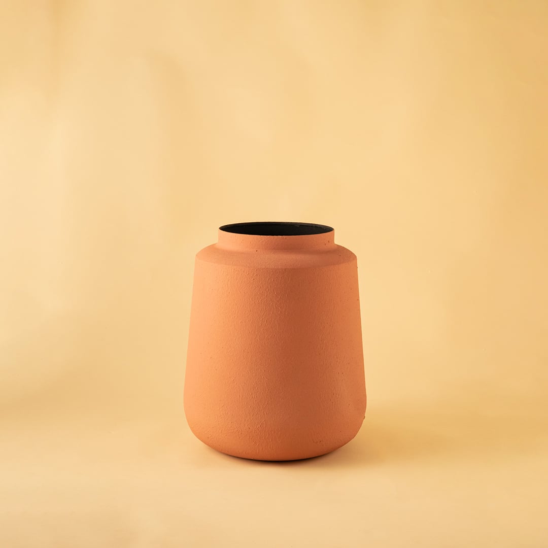 Terracotta metal textured vase decor on a clean white background highlighting its warm matte finish for versatile home styling.