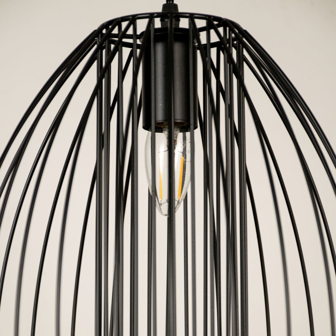 Close view of black cage pendant light showing detailed metal rods and clean craftsmanship with sleek industrial modern finish.