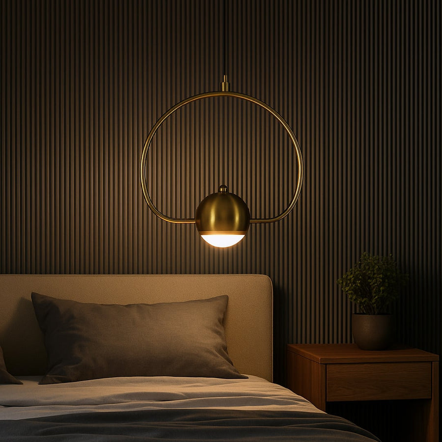 Luxury brass gold wall lamp with circular frame and frosted globe shade adding warm lighting to modern bedroom interiors.