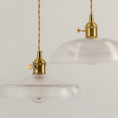 Clear embossed glass pendant light with polished gold hardware crafted for kitchens and dining areas.