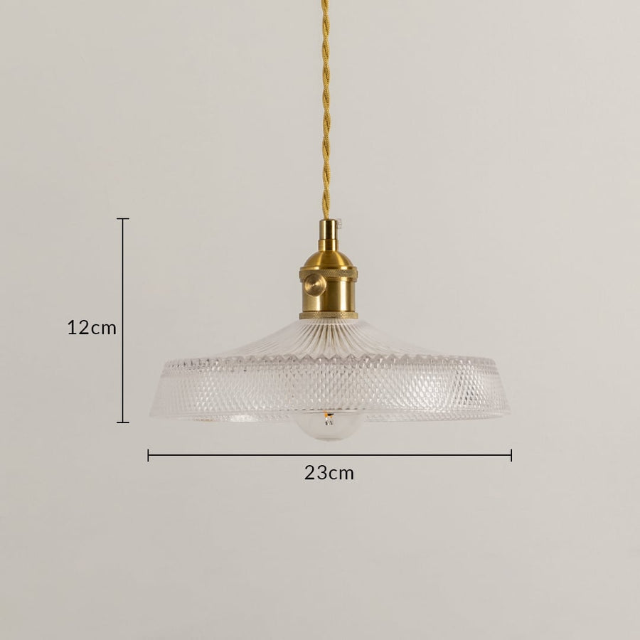 Dimension image of textured clear glass pendant light with brass holder showing 12 cm height and 23 cm width.