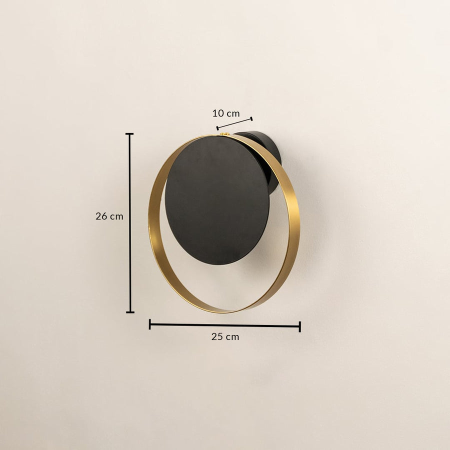 Modern black and brass wall light measuring 30 cm height and 25 cm width for stylish interiors.