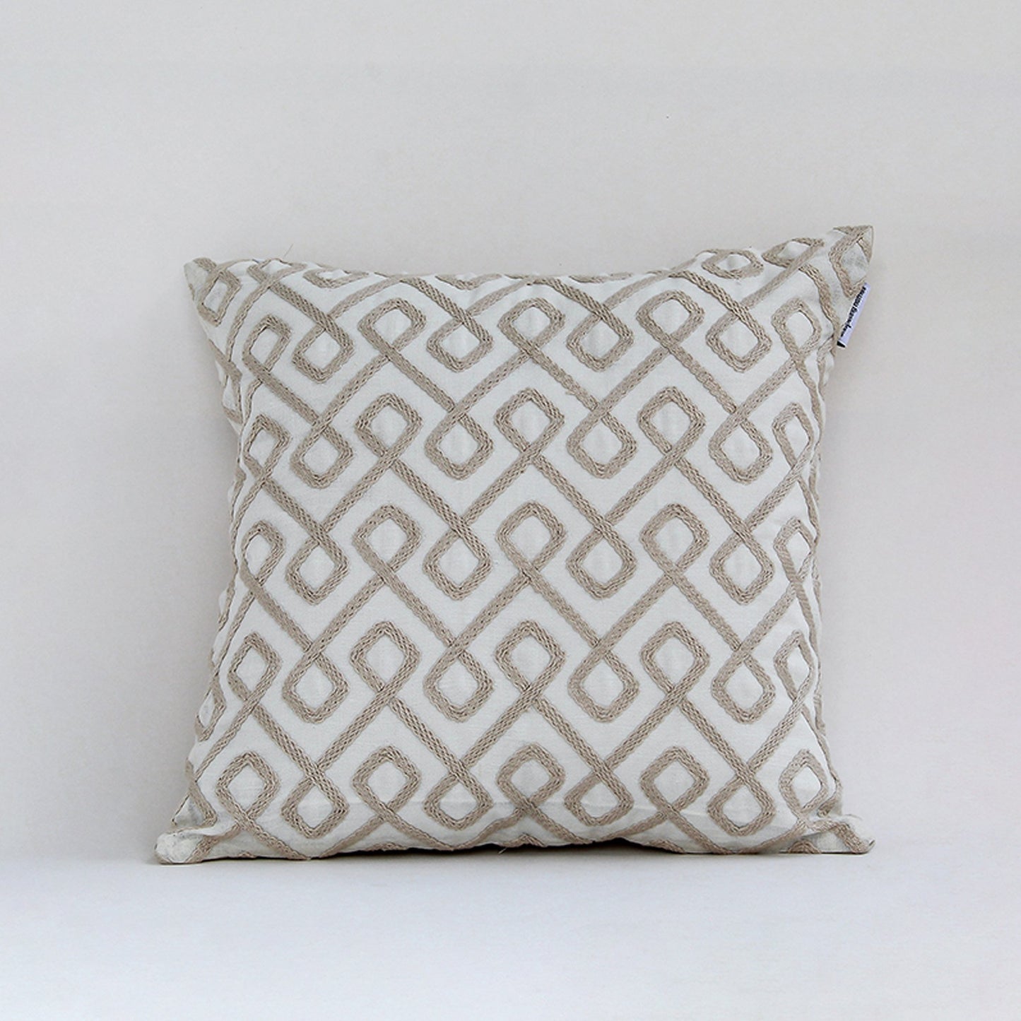 White cotton cushion cover with beige geometric pattern for sofa couch bedroom and modern home decor styling.
