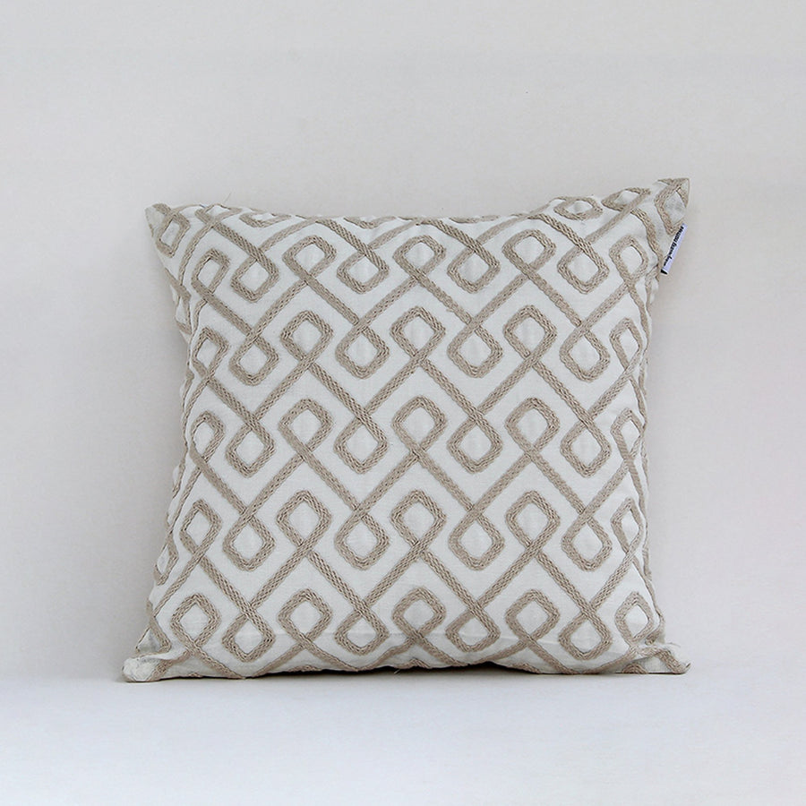 White cotton cushion cover with beige geometric pattern for sofa couch bedroom and modern home decor styling.
