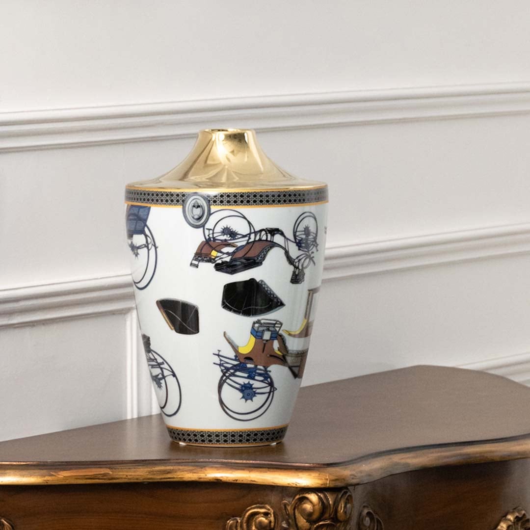 White ceramic jar with blue and gold floral artwork in a front view perfect for artistic décor styling and elegant interior placement.