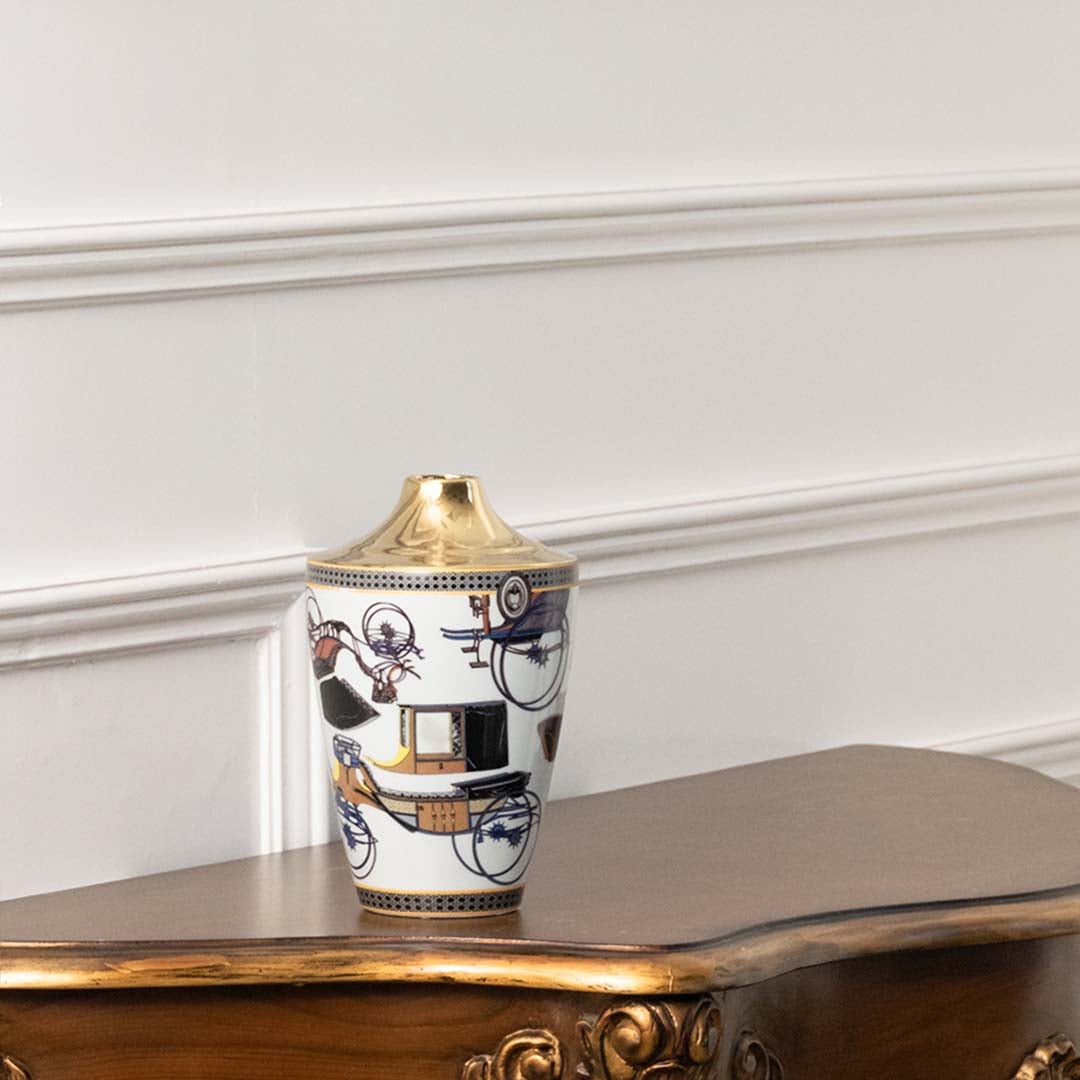 White ceramic jar with blue and gold artwork in a front view perfect for luxury décor styling and elegant console display.