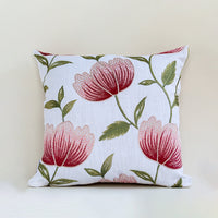 Soft cotton cushion cover with bold red floral embroidery shown in front view providing a bright nature inspired décor accent with a breathable gentle and skin friendly fabric texture.