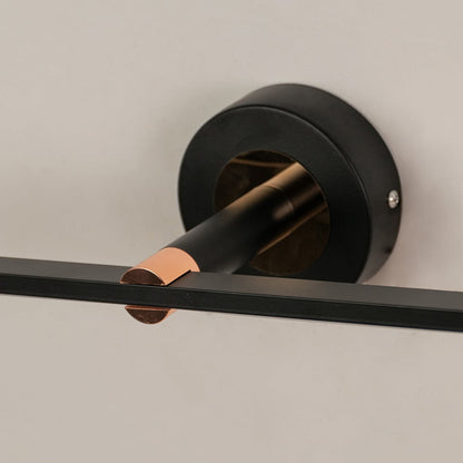 Black metal picture light with gold accent detailing showcasing premium craftsmanship and contemporary design appeal.