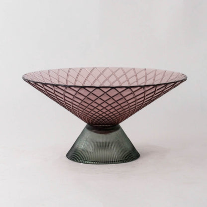 Smoky pink glass decorative bowl with green pedestal base for elegant tabletop styling and contemporary home decor.