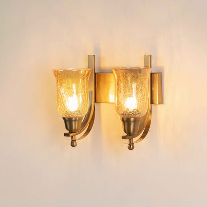 Gold metal wall light with dual glass shades on white background perfect for bedroom living room and hallway decor.