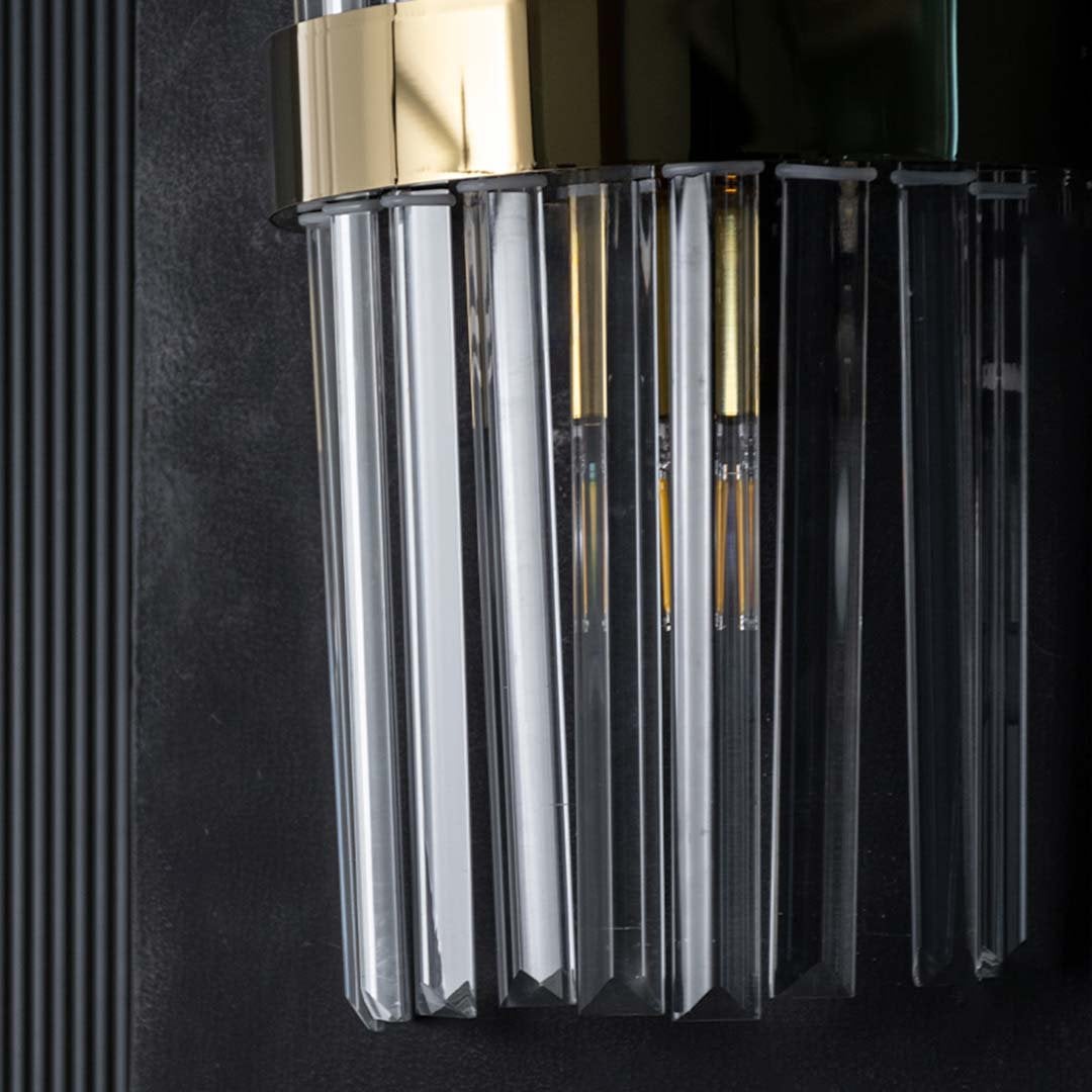 Detailed closeup capturing the refined edges of the crystal rods and the smooth metallic band showing the high end craftsmanship of the design.