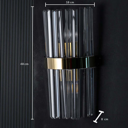 Crystal wall light shown with dimensions measuring 48 cm in height 18 cm in width and 8 cm in depth with clear rods and a polished gold band.