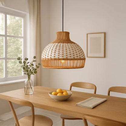 Natural rattan pendant light above dining table creating warm bohemian ambiance and rustic elegance.