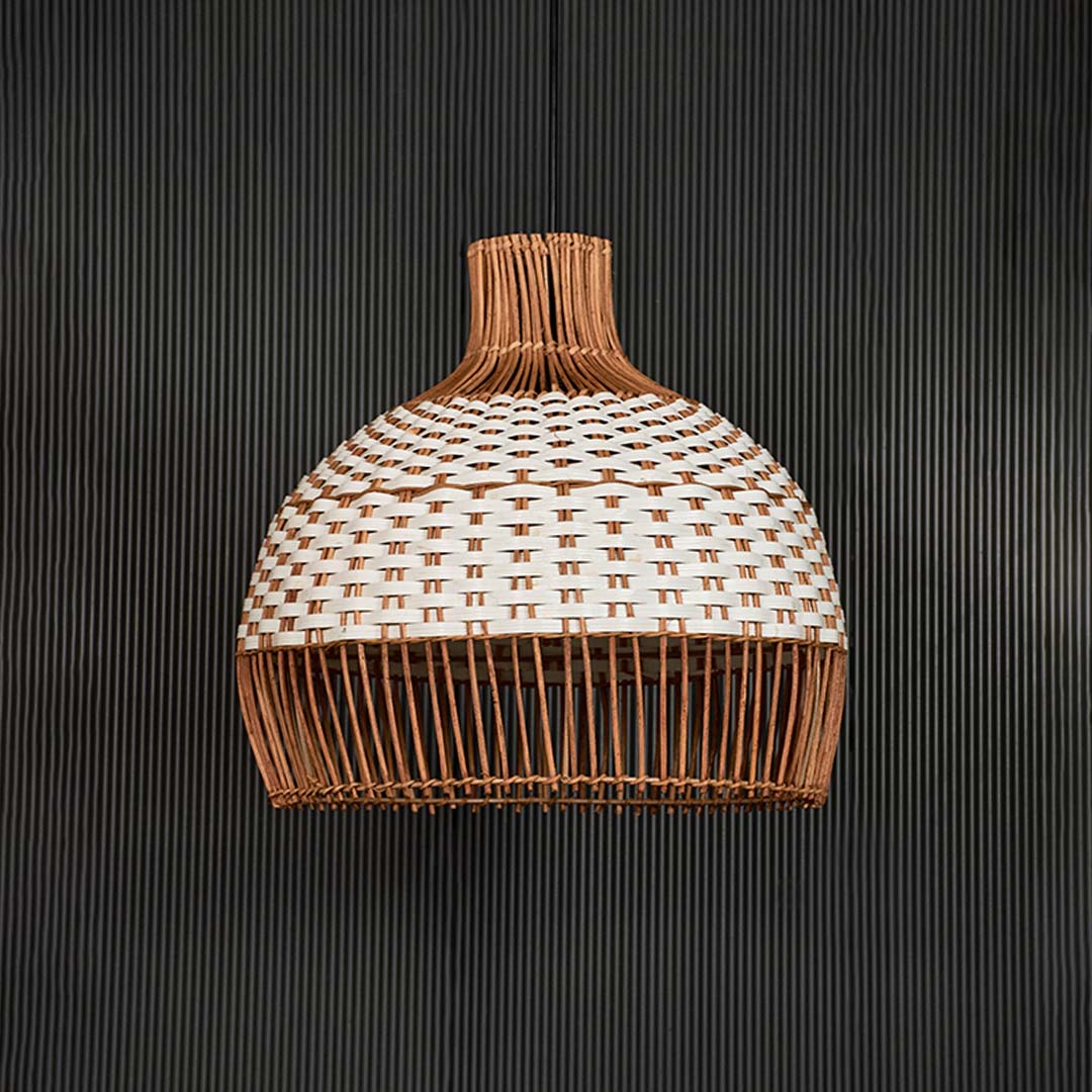 Natural and white rattan pendant light with woven design for elegant coastal inspired interiors.