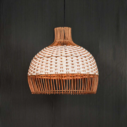 Natural and white rattan pendant light illuminated with warm glow for inviting living spaces.